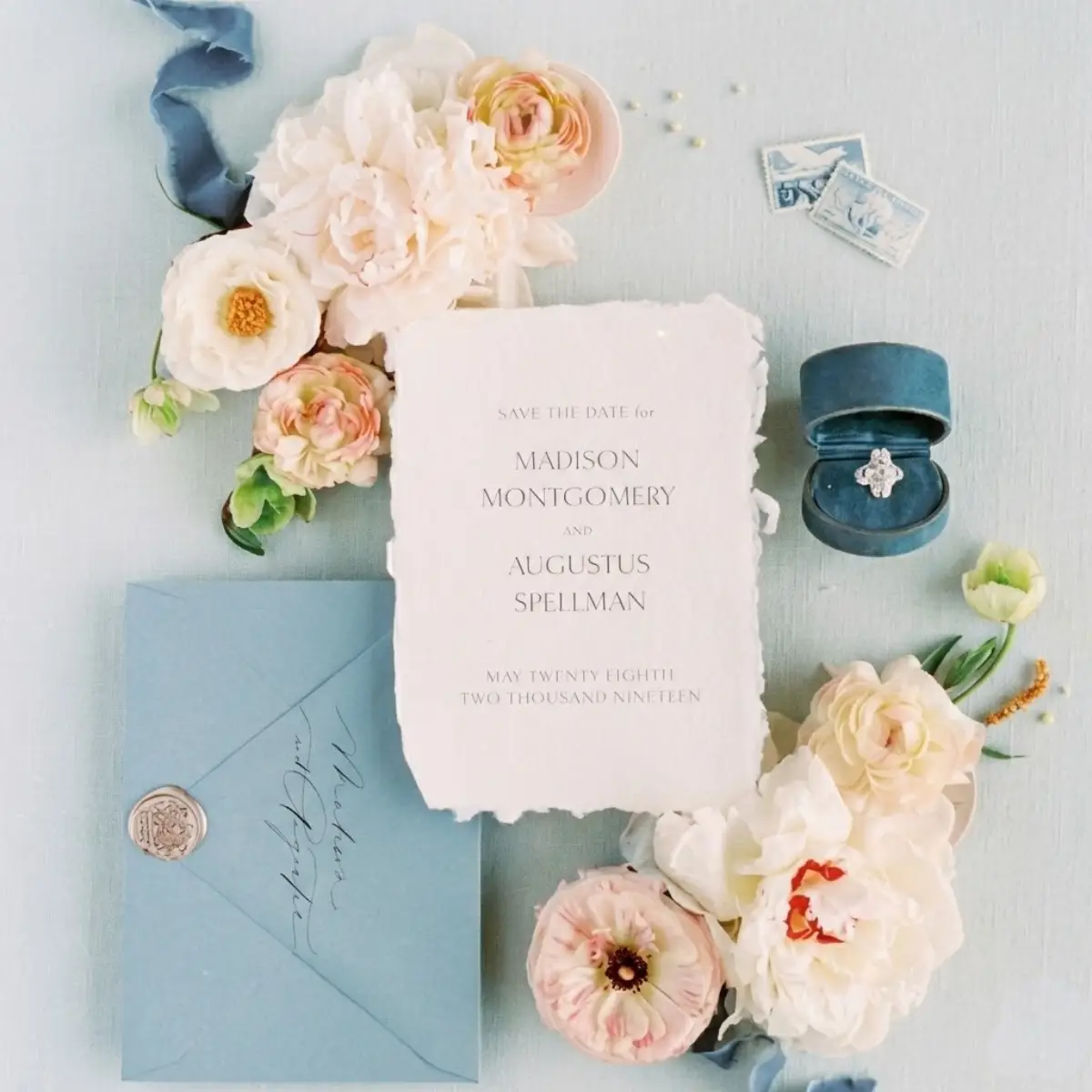 Elegant wedding save the date flat lay with flowers and stationery – full-service event planning by Catherine Cole Events